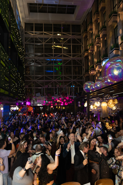 A crowd dances in the High Street Place atrium.
